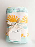 sun and wave surfer print organic cotton bamboo muslin baby blanket