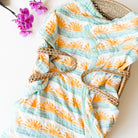 soft and gauzy bamboo cotton muslin baby blanket with surf theme print