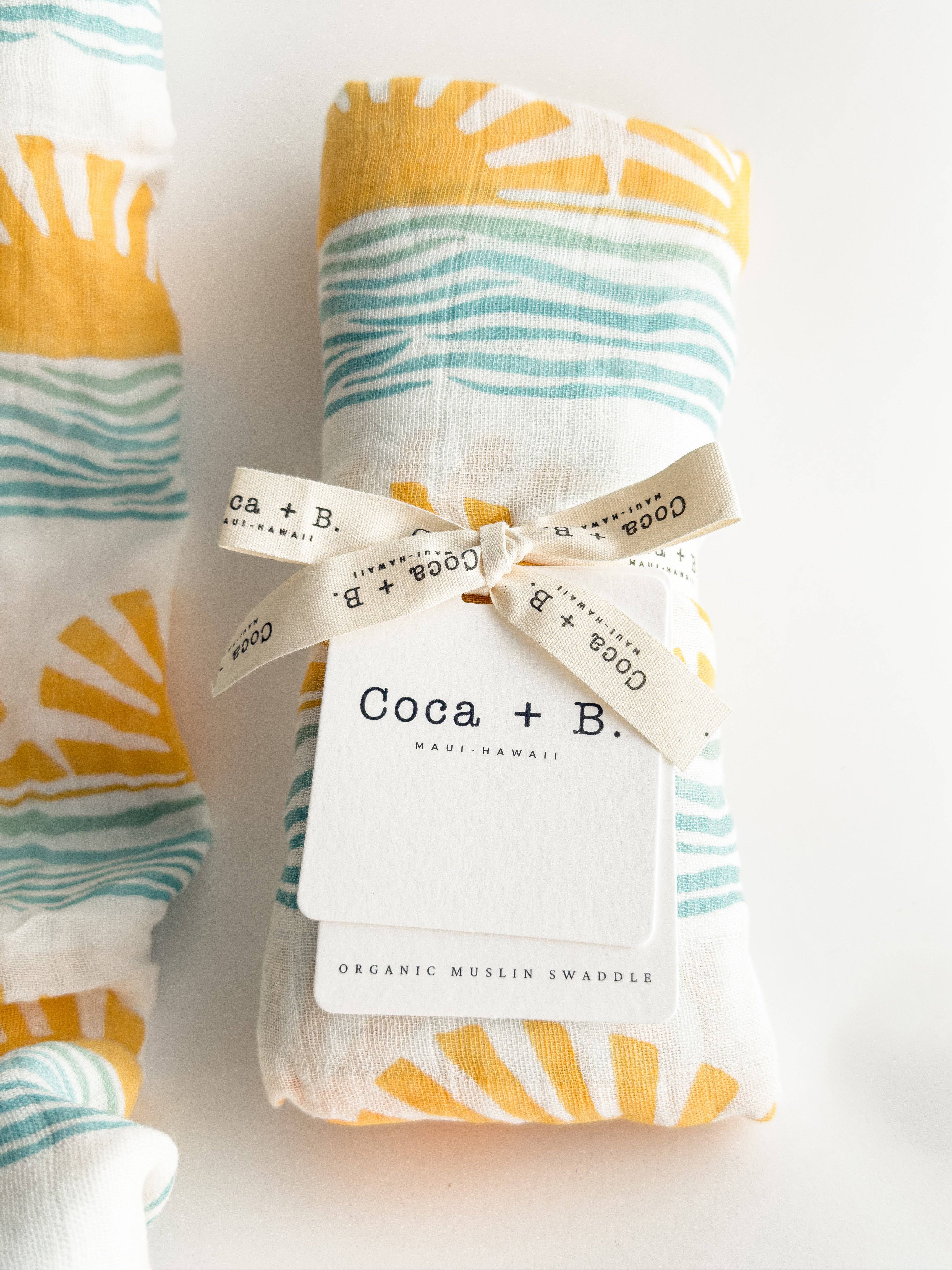 sun and ocean wave print surfer baby swaddle wrapped