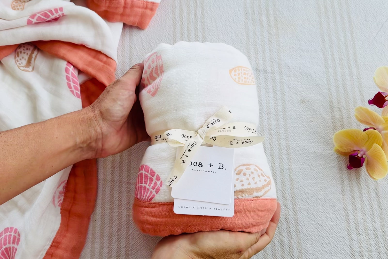 Organic Baby Blanket in Seashell Print with terracotta trim