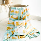 thikc organic surfer baby blanket with sun and wave print in yellow and blue